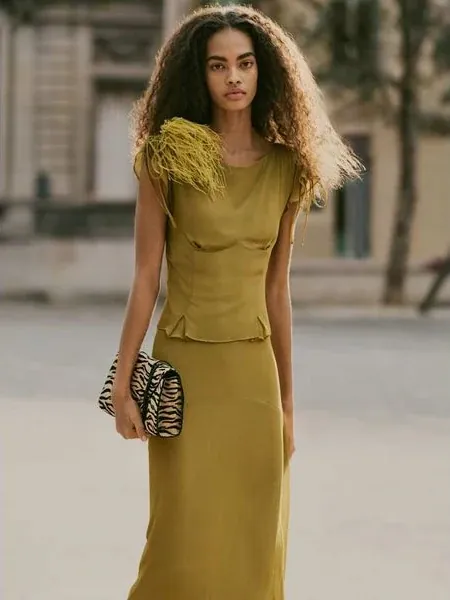 Reformation Elysia two piece in citrine, styled on the street